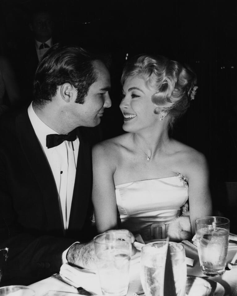 Loni Nelson and Burt Reynolds look into each other's eyes at a party in Hollywood, CA in 1960. The two wouldn't marry until 1988, and would divorce five years later in 1993. Reynolds' first wife was Judy Carne, from 1963 to 1965.