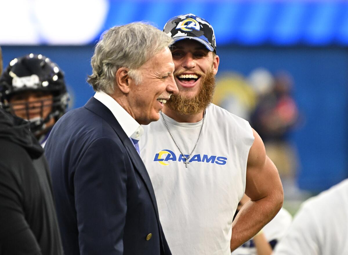 Rams wide receiver Cooper Kupp and owner Stan Kroenke share a laugh before a game against the Texans on Aug. 18, 2022.