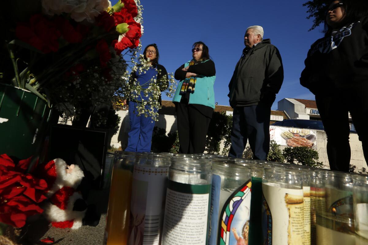 Mourners gather in 2015 at the roadside memorial near South Avenue 60 and North Figueroa Street in Highland Park where 17-year-old Andres Perez was killed while walking to his school.
