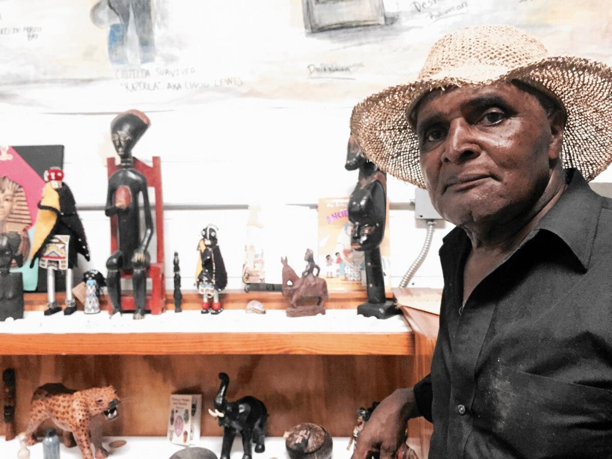 Charles Hope, who was born in Africatown, in "the den," a building that houses artifacts from the Alabama community's past.