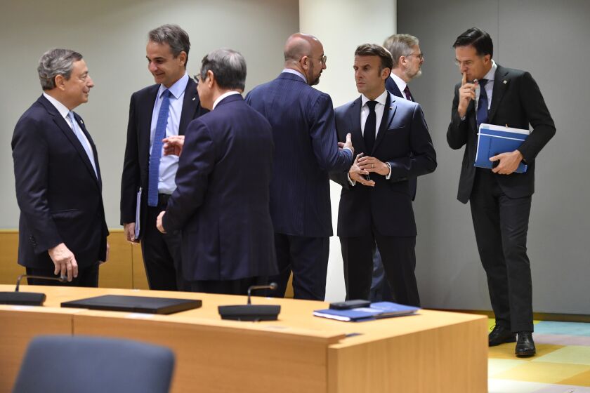 European Council President Charles Michel, center left, speaks with French President Emmanuel Macron, center right, during a round table meeting at an EU summit in Brussels, Friday, Oct. 21, 2022. European Union leaders are gathering Friday to take stock of their support for Ukraine after President Volodymyr Zelenskyy warned that Russia is trying to spark a refugee exodus by destroying his war-ravaged country's energy infrastructure. (AP Photo/Geert Vanden Wijngaert)