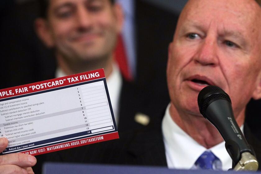 WASHINGTON, DC - SEPTEMBER 27: U.S. Rep. Kevin Brady (R-TX) (R) holds up a tax filing "postcard" as Speaker of the House Rep. Paul Ryan (R-WI) (L) looks on during a press event on tax reform September 27, 2017 at the Capitol in Washington, DC. On Wednesday, Republican leaders proposed cutting tax rates for the middle class, wealthy and businesses. Key questions remain on how they plan to offset the trillions of dollars in lost tax revenue. (Photo by Alex Wong/Getty Images) *** BESTPIX *** ** OUTS - ELSENT, FPG, CM - OUTS * NM, PH, VA if sourced by CT, LA or MoD **