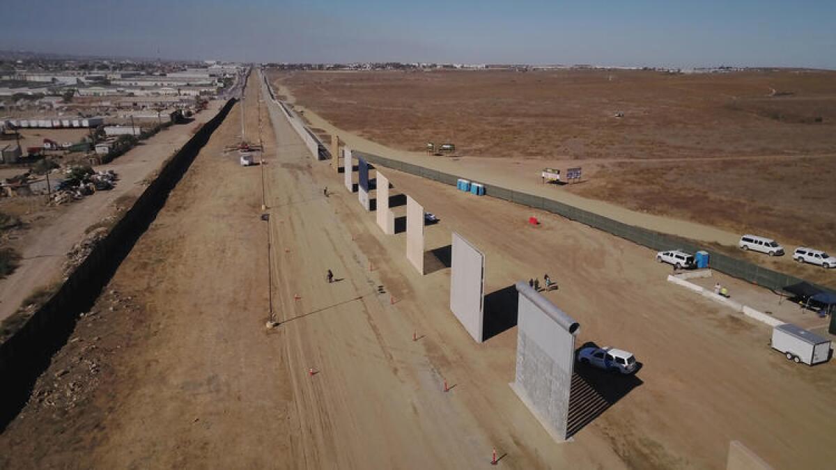 An aerial view shows seven of the eight entries in the competition to build President Trump's border wall