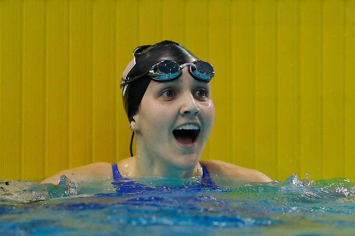 Hannah Moore celebrates winning the gold medal in the women's 400-meter freestyle, one of two she captured at the 2014 Youth Olympic Games in Nanjing, China.