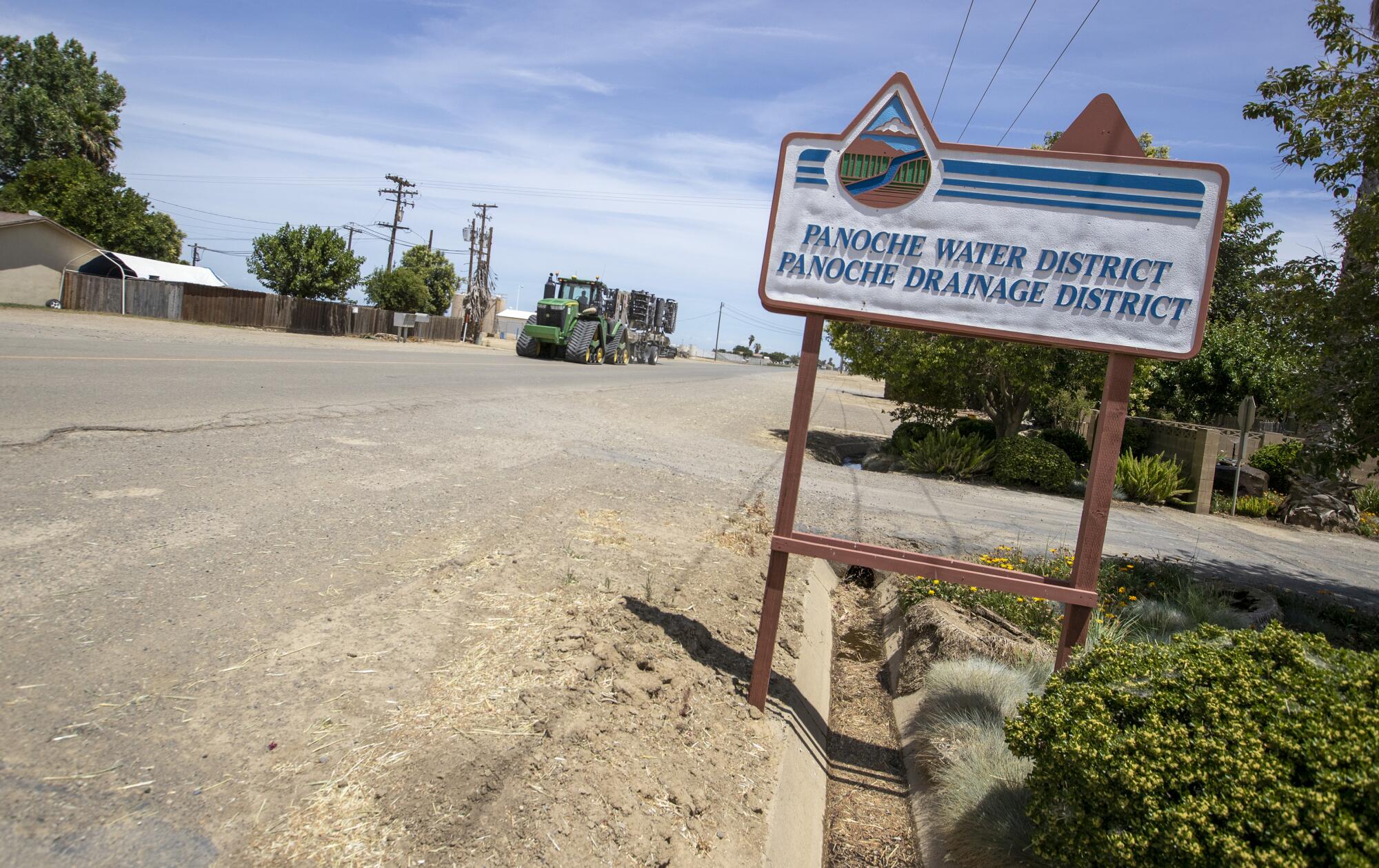 A sign marks the headquarters of the Panoche Water District.