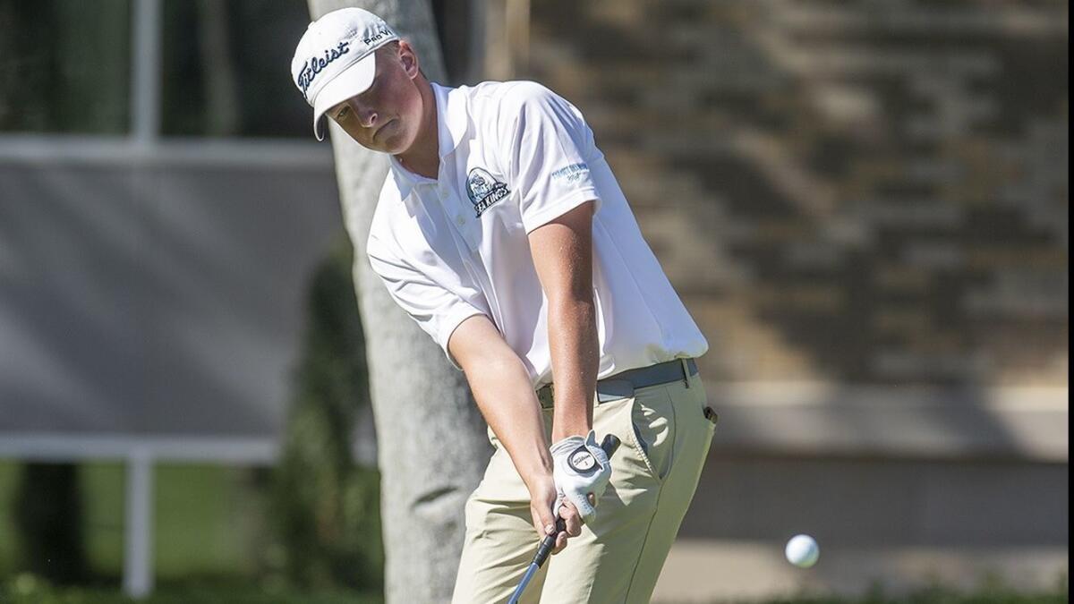 Corona del Mar High's T.J. Jenkins, seen hitting a chip shot at Newport Beach Country Club on April 18, helped the Sea Kings earn a 188-207 win over Huntington Beach in Wednesday's Surf League match.
