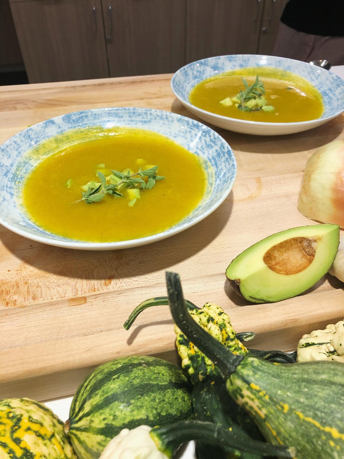 A butternut squash soup with some sliced avocado  at the Leonard Cancer Institute.