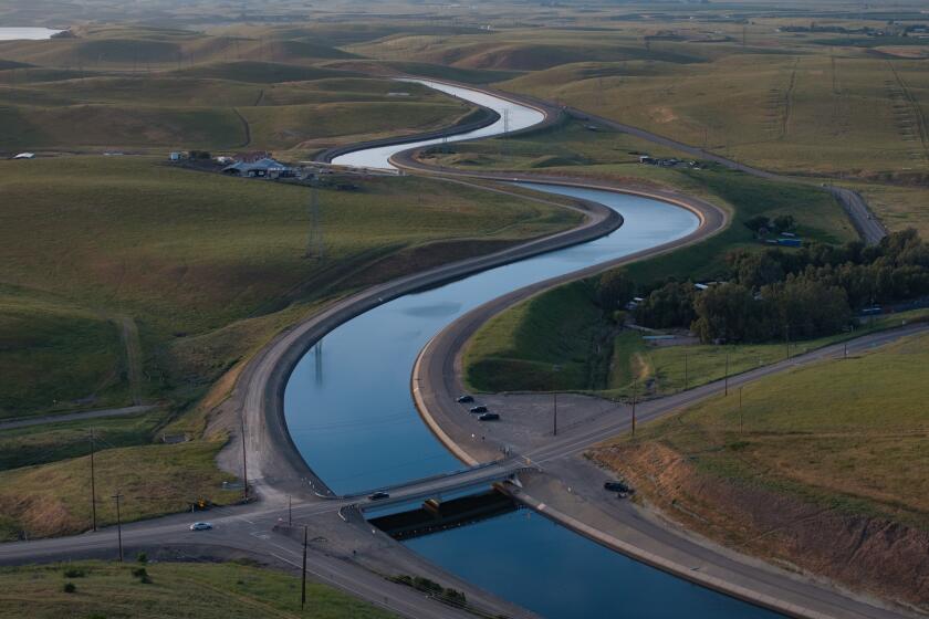 BYRON, CA APRIL 18, 2024 - The California Aqueduct meanders its path from north to south, lower, on Thursday, April 18, 2024 in Byron, Calif. (Paul Kuroda / For The Times)