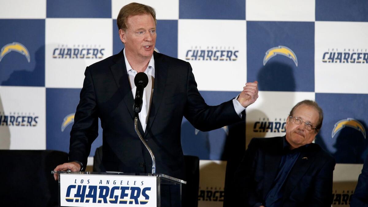 NFL Commissioner Roger Goodell speaks, while Chargers chairman Dean Spanos listens.