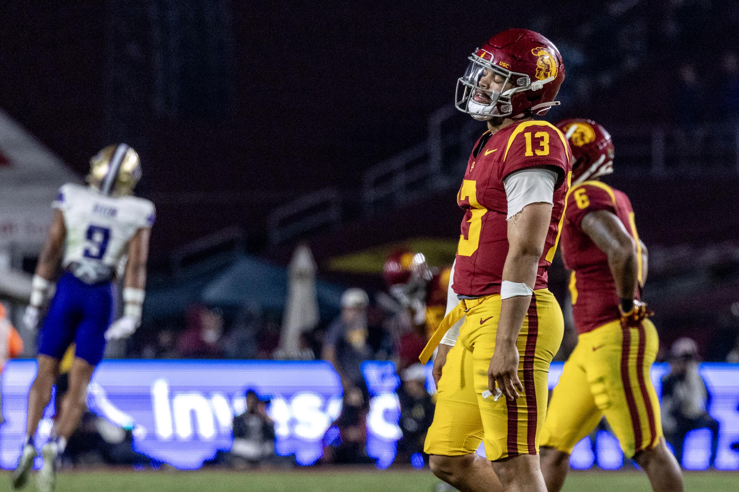 USC quarterback Caleb Williams walks off the field in the final moments of the Trojans' loss to Washington at the Coliseum.
