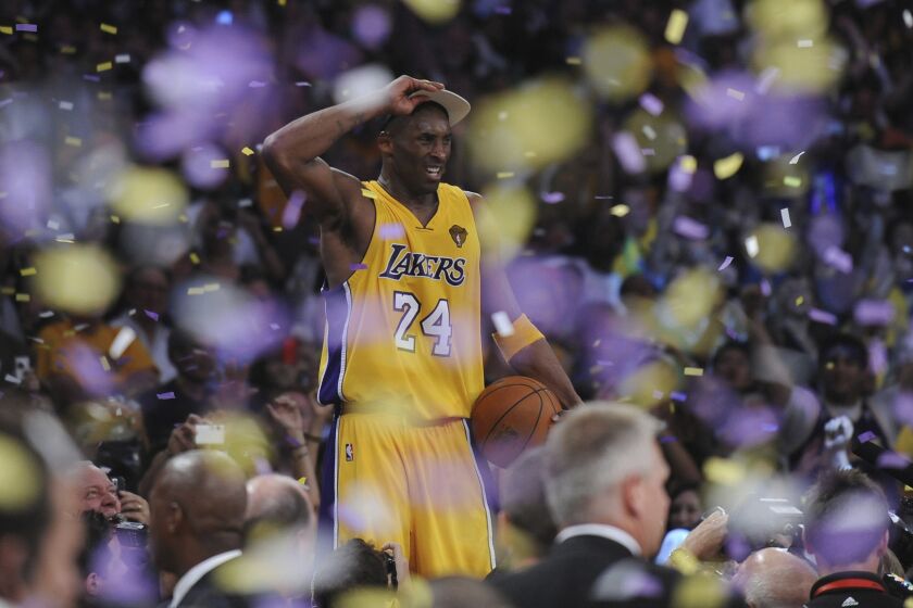 LOS ANGELES, CA – JUNE17, 2010 ––Kobe Bryant stands on the scorers table after Lakers defeated the Celtics.