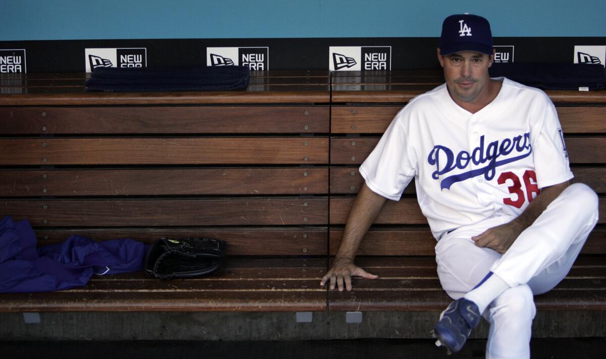 Greg Maddux, shown in the dugout in 2006, is back with the Dodgers, this time in the front office.