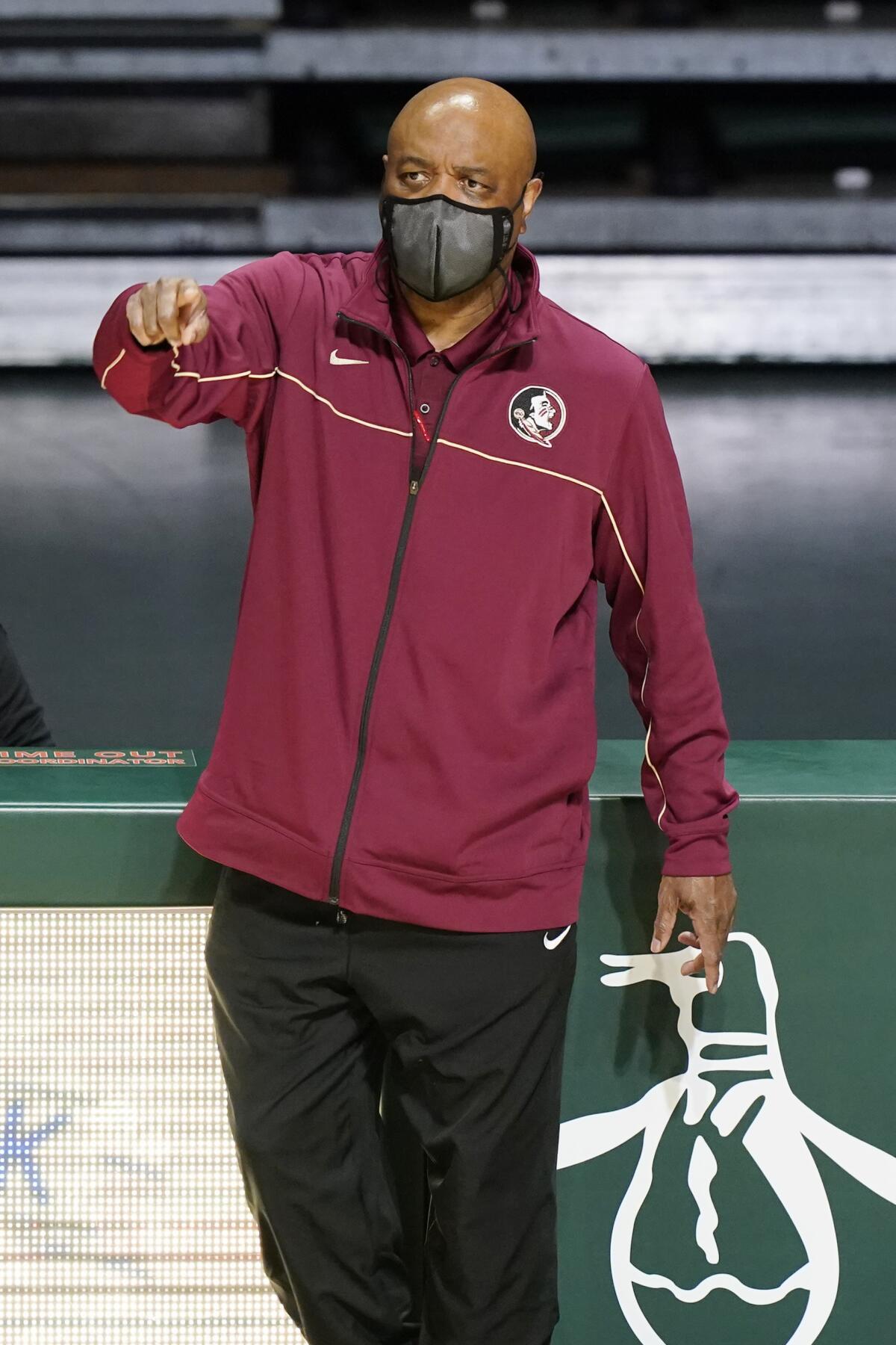 Florida State head coach Leonard Hamilton gestures during the second half of an NCAA college basketball game against Miami, Wednesday, Feb. 24, 2021, in Coral Gables, Fla. (AP Photo/Marta Lavandier)