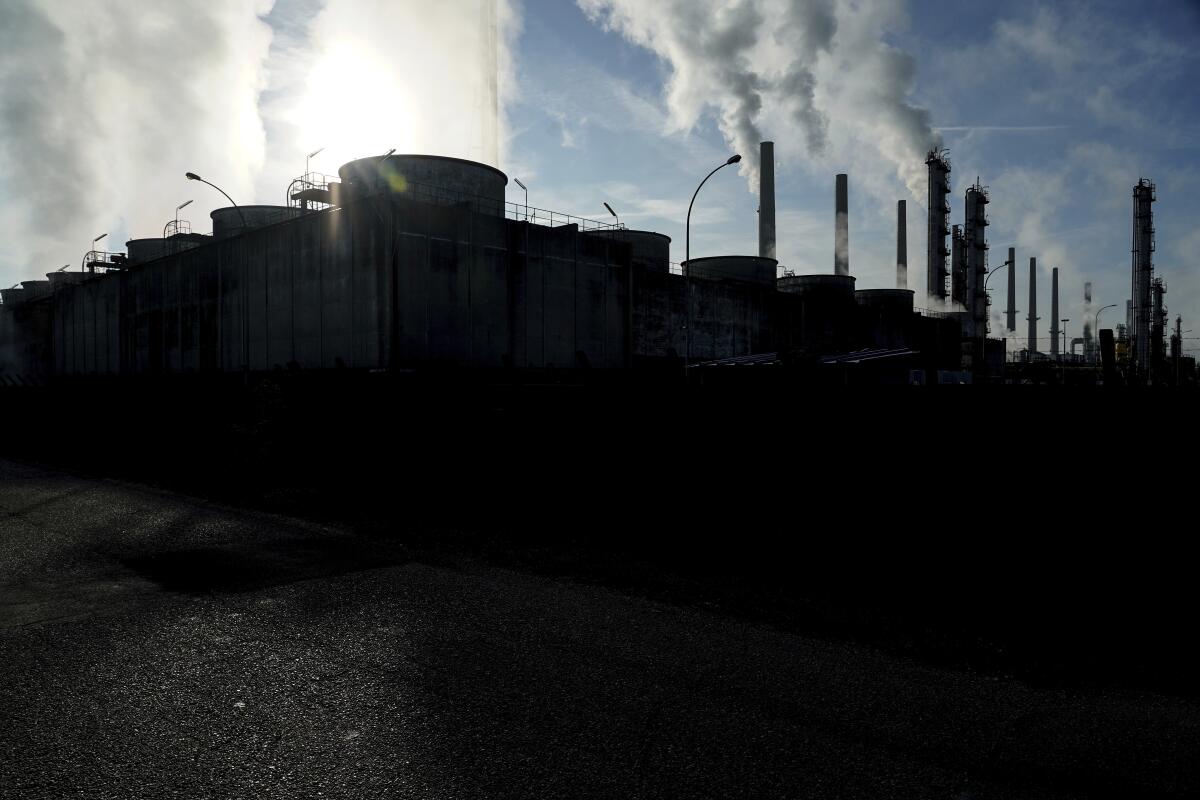 Smoke rising from refinery chimneys in France