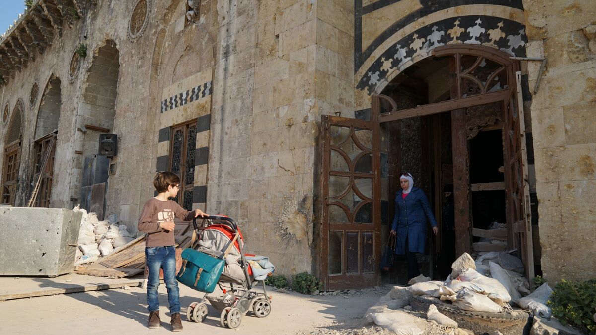 The entrance of Aleppo's historic Umayyad mosque, in the historic Old City, bears scars from fighting between rebel and government forces during Syria's war.