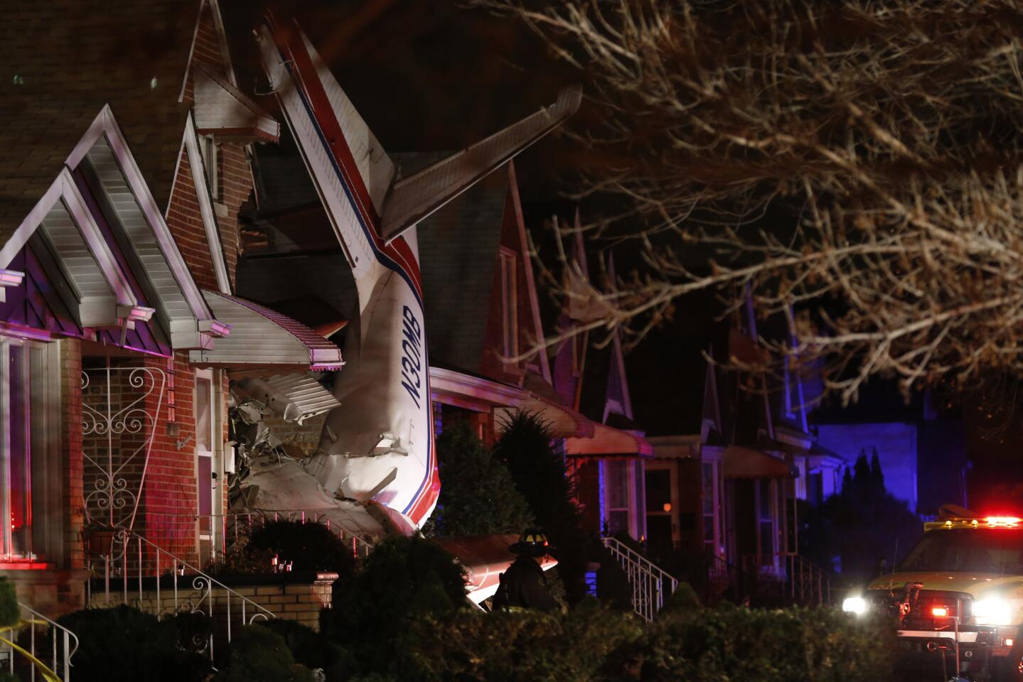 Plane crashes into house