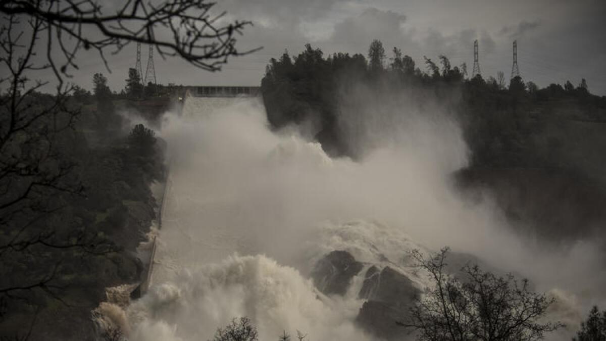 Water cascades down the spillway below the Oroville dam.