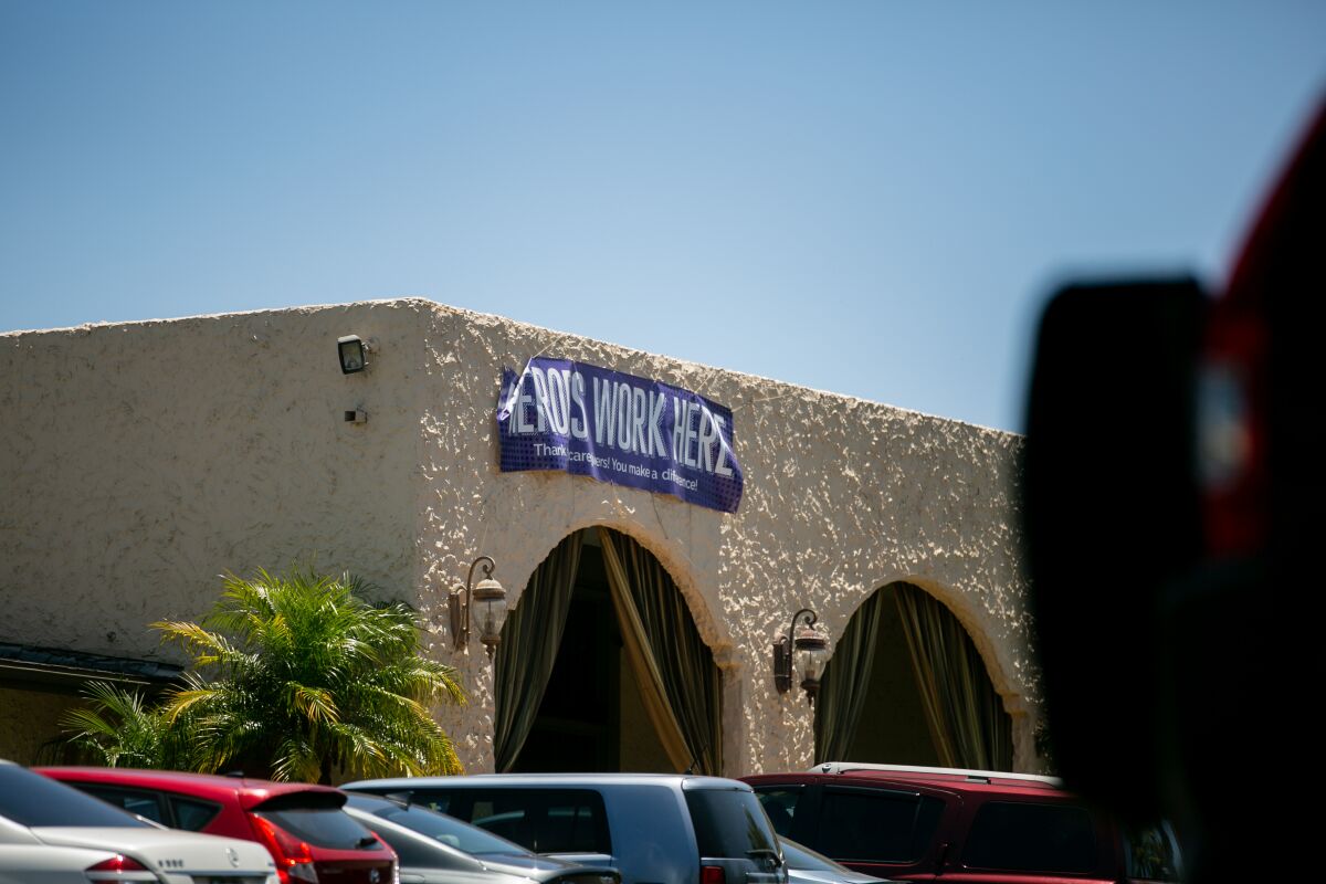 A sign thanking healthcare workers hangs outside the Reo Vista Healthcare Center on Thursday.