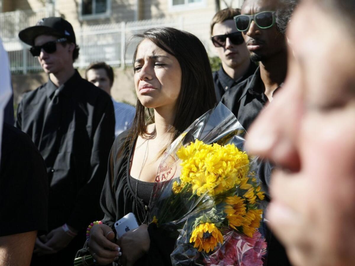 Mourners attend the funeral for Malak Hariri at Pierce Brothers Valhalla Memorial Park in North Hollywood on Friday, Oct. 4, 2013. About 400 people came to pay their respects at the funeral. Hariri was one of five people who died in a single vehicle car crash last Saturday in Burbank.