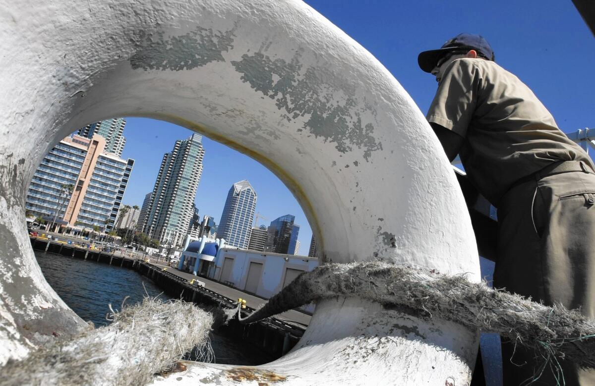 Matthew Pinhey, 23, looks out from the fantail of the Golden Bear in San Diego, where it stopped on a training voyage back to the home port of Vallejo. The ship is run by California State University Maritime Academy.