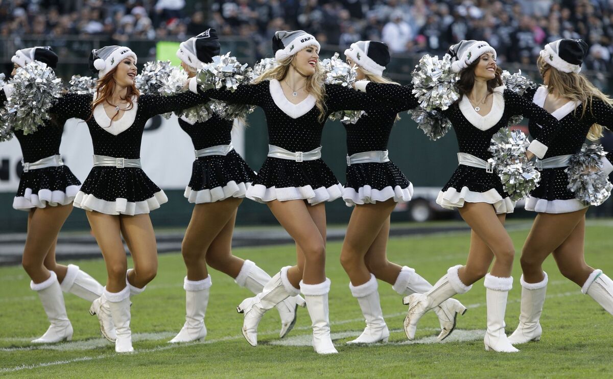 Oakland Raiders cheerleaders perform during the second half of an NFL football game between the Oakland Raiders and the Buffalo Bills in December.