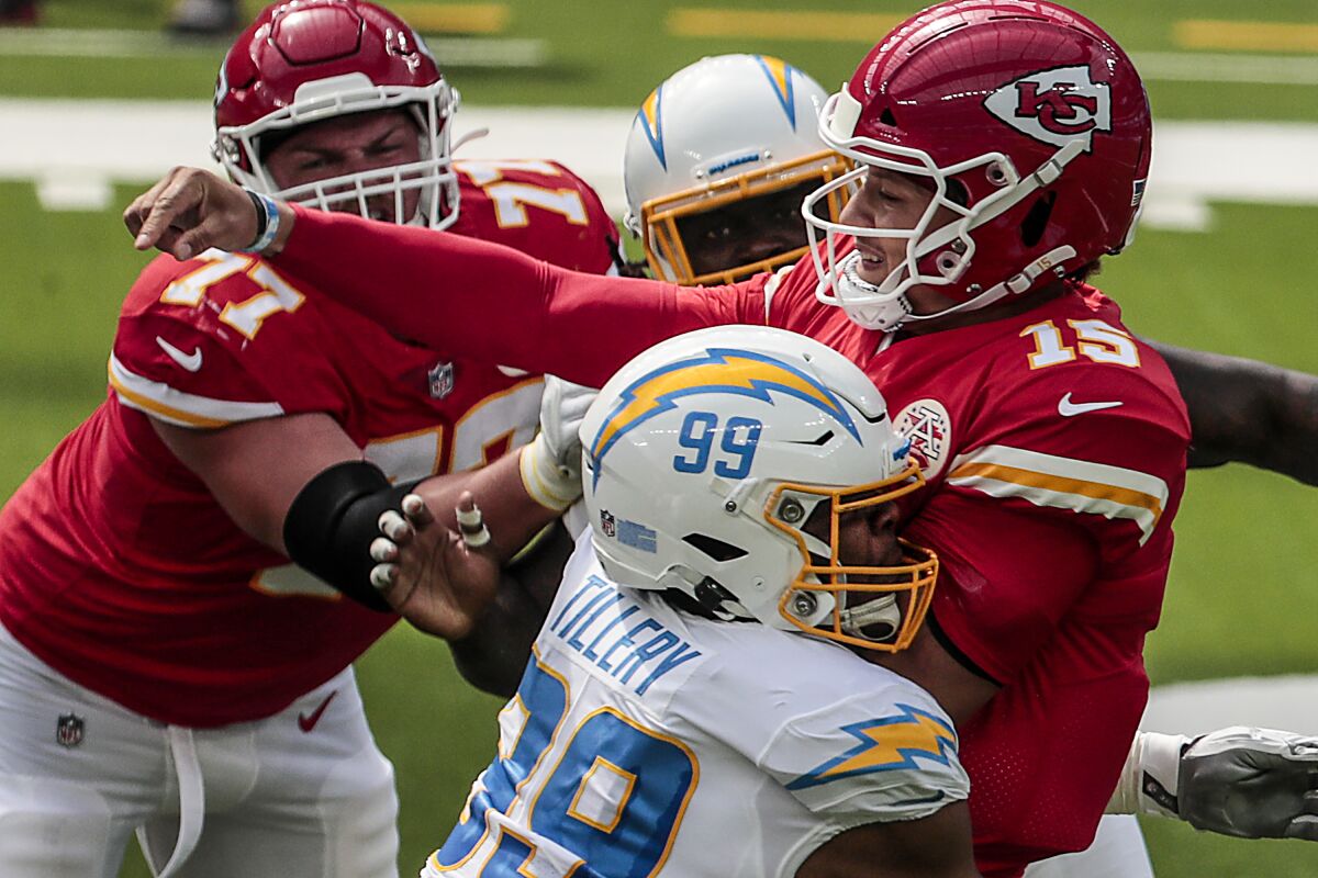 Chargers defensive tackle Jerry Tillery hits Kansas City Chiefs quarterback Patrick Mahomes.