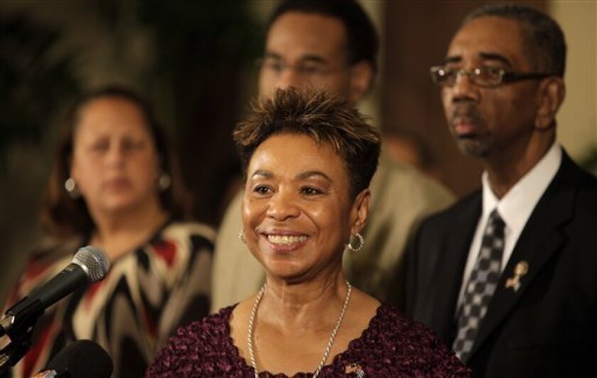 Rep. Barbara Lee, D-Calif., front, reacts during a news conference in Havana, Tuesday, April 7, 2009. Cuba's President Raul Castro met Monday with six visiting members of the Congressional Black Caucus for more than four hours, his first face-to-face discussions with U.S. leaders since he became Cuba's president last year. Back from left to right; Rep. Laura Richardson, D-Calif., Rep. Emanuel Cleaver, D- MO., Rep. Bobby Rush, D- IL. (AP Photo/Javier Galeano)