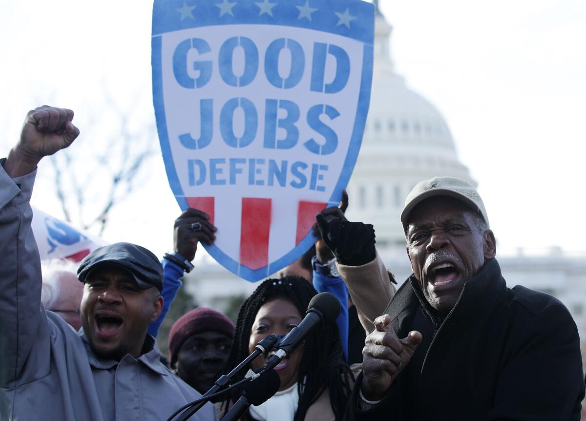 Actor Danny Glover, right, at a rally in Washington, D.C., in February.