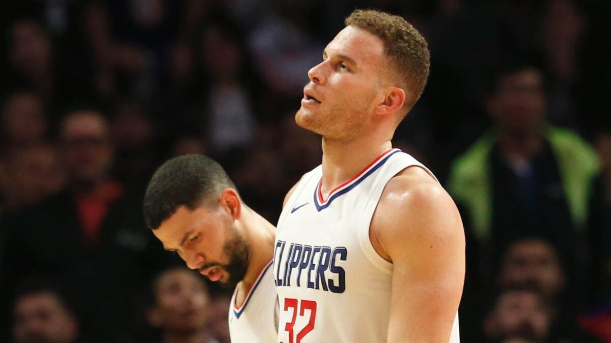 Clippers' Blake Griffin on the court after injuring his knee Nov. 27 against the Lakers.