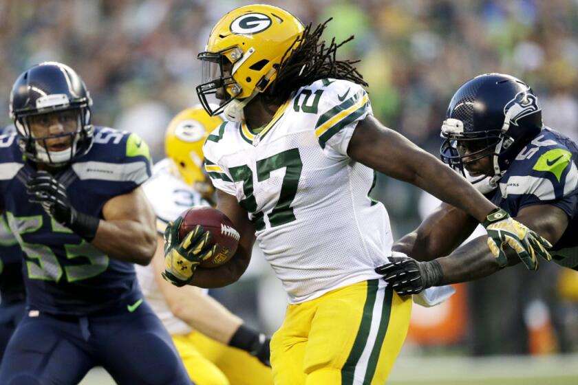 Packers running back Eddie Lacy looks for room to run against the Seahawks in the NFL season opener.