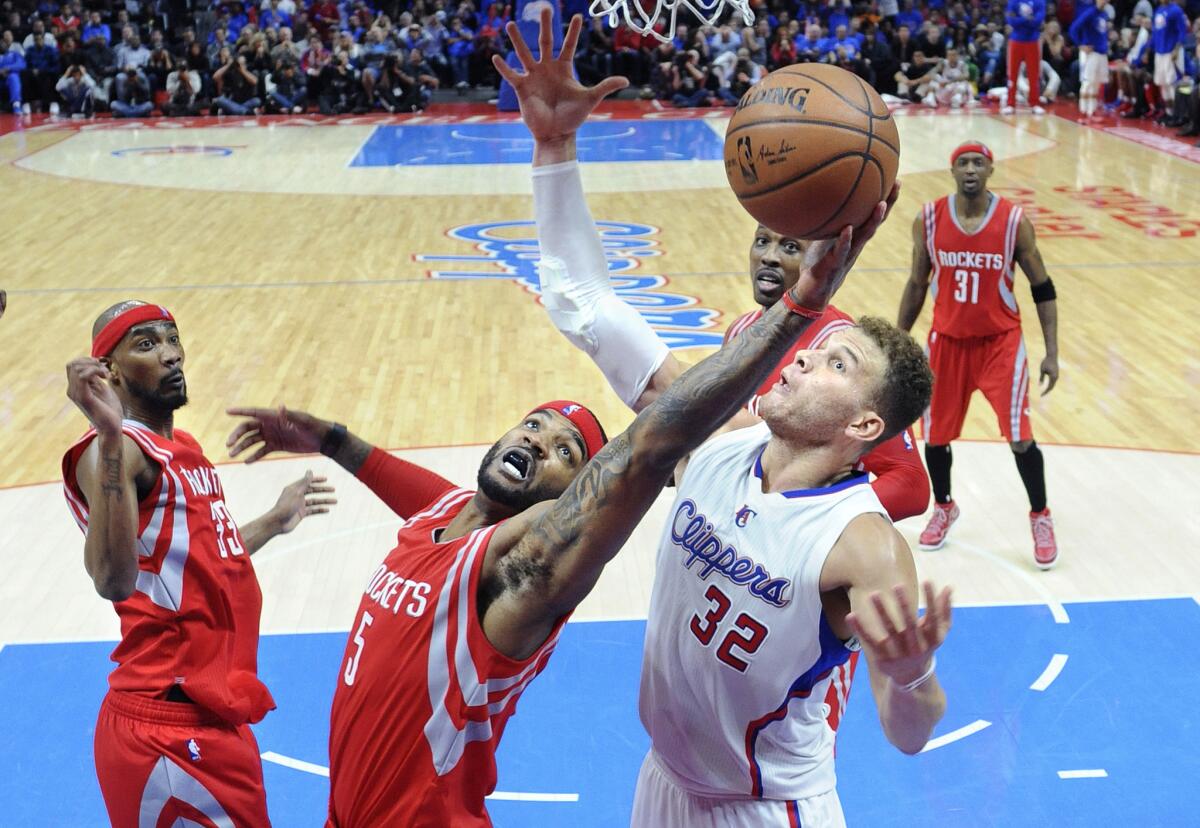 Rockets forward Josh Smith grabs a rebound away from Clippers forward Blake Griffin during Game 6 of this year's Western Conference semifinals.