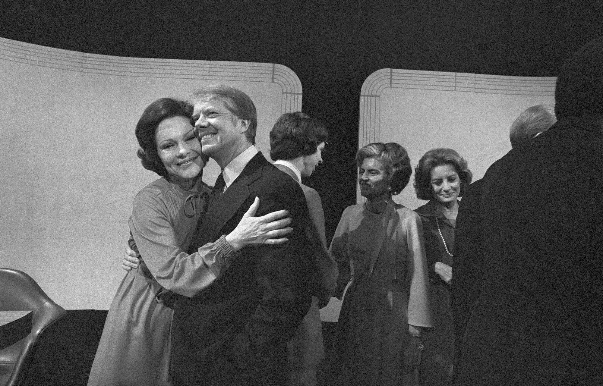 Rosalynn Carter hugs Jimmy Carter after a presidential debate.
