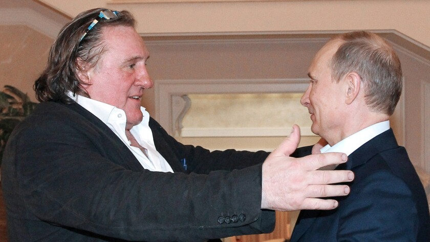 Gerard Depardieu, left, and Russian President Vladimir Putin greet each other during a meeting in Putin's residence in Sochi in January 2013 after the French actor had been granted Russian citizenship.