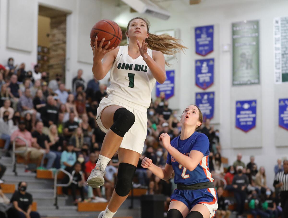 Emily Elliott drives into the lane for a layup during a CIF State Southern California Regional Division 2-A semifinal game.