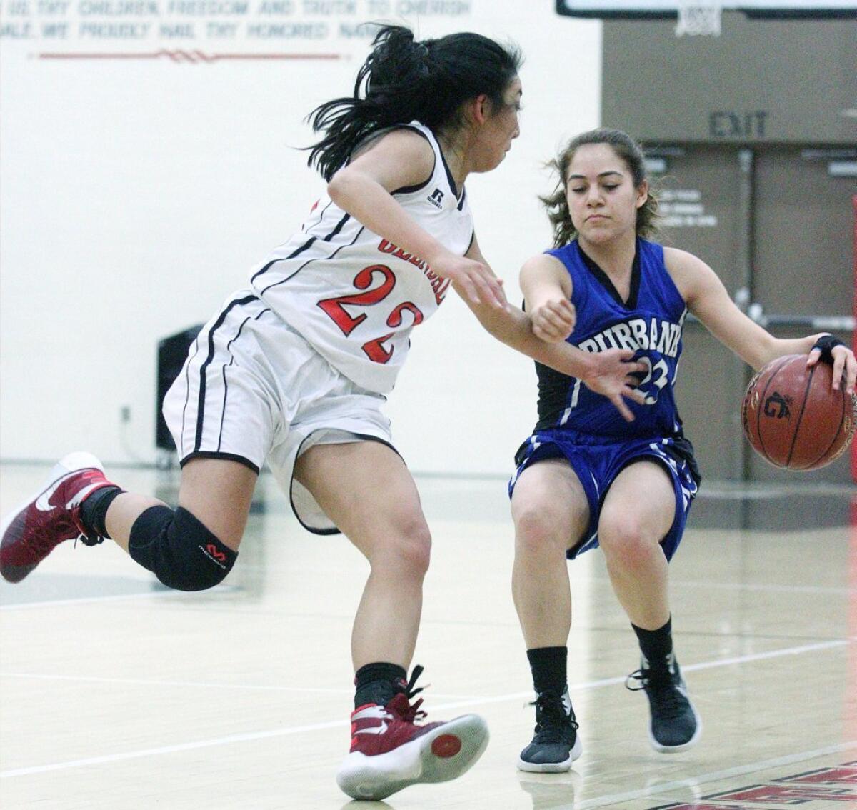 Burbank's Celine Shamalian brings the ball up and is stopped by the pursuing defense of Glendale's Jillian Yanai.