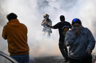 Chicago residents and protesters clash with federal agents.