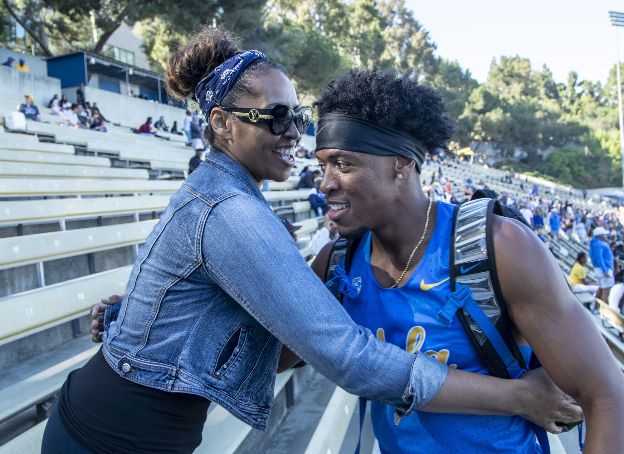 UCLA's Zaylon Thomas embraces his mom, Wanda McKinney.