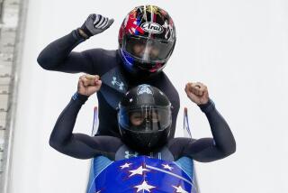 Elana Meyers Taylor and Sylvia Hoffman, of the United States, celebrate after the women's bobsleigh.