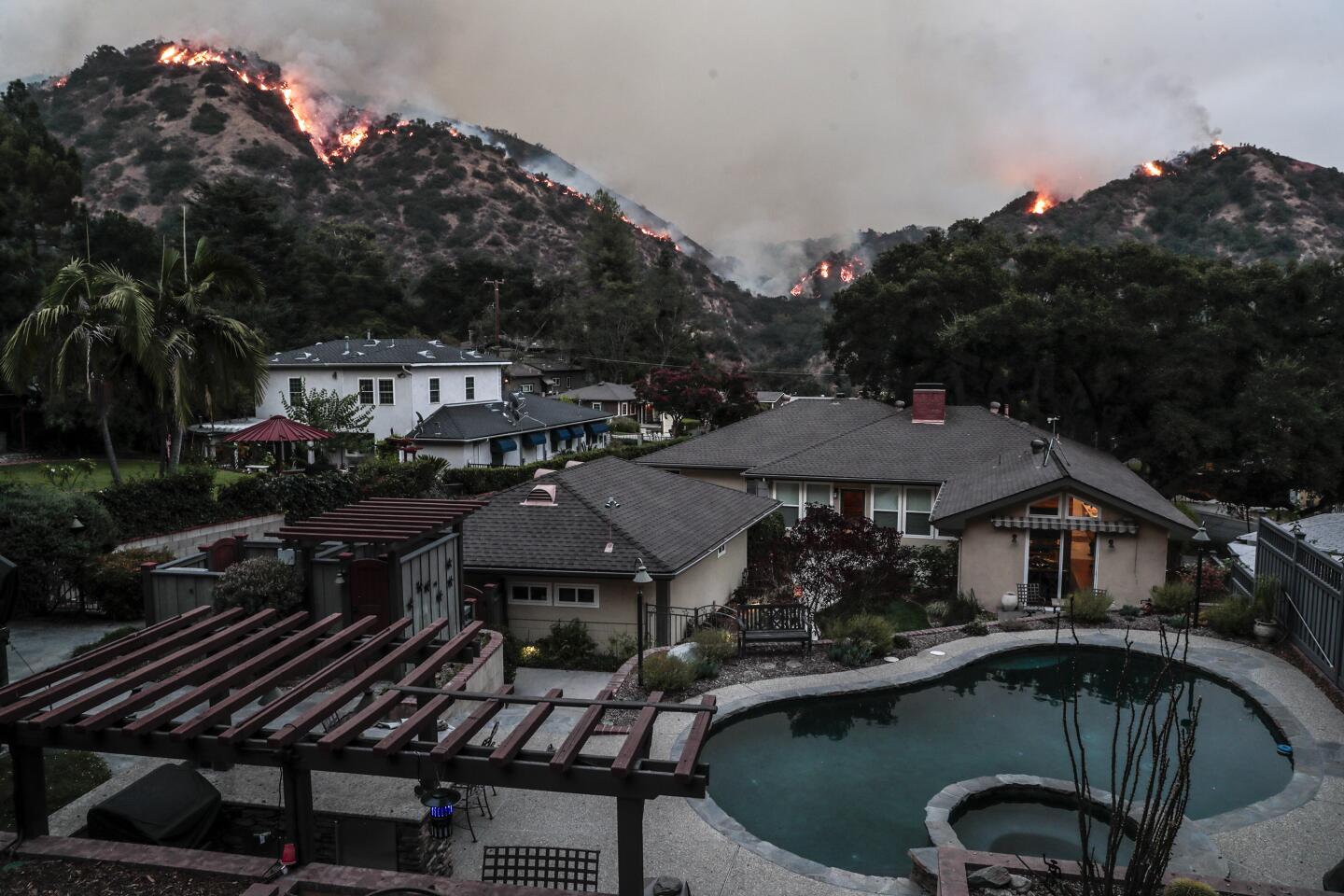 Flames from the Bobcat fire approach homes in Monrovia