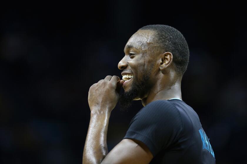 Hornets guard Kemba Walker reacts after a play against the Lakers. He scored 38 points in 42 minutes.