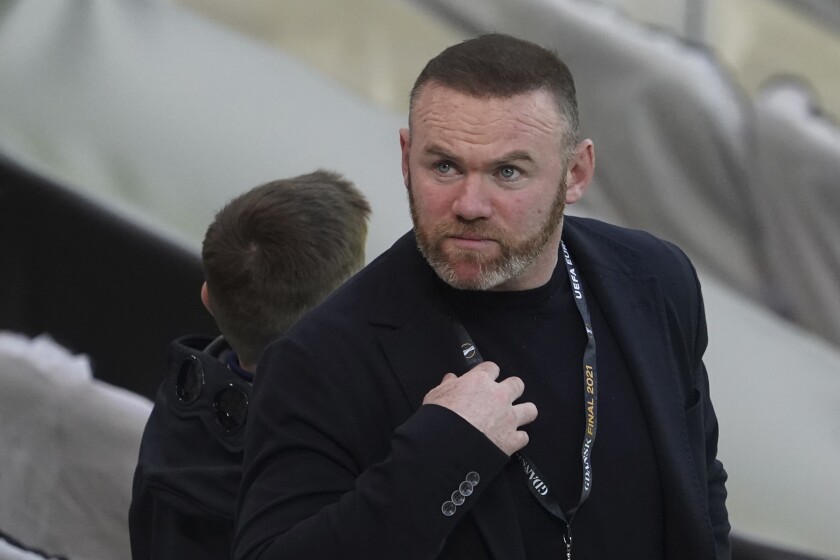 FILE - Former Manchester United player Wayne Rooney attends the Europa League final soccer match between Manchester United and Villarreal in Gdansk, Poland on May 26, 2021. Rooney has resigned as Derby manager after 18 months in charge and on the same day the club appeared to have sorted out its financial difficulties. (Aleksandra Szmigiel/Pool Photo via AP, File)