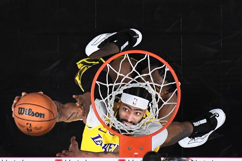 San Francisco, California May 2, 2023-Lakers Anthony Davis beats Warriors Kevon Looney to the basket in the first half in Game 1 of the Western Conference semifinal at Chase Center in San Francisco Tuesday.(Wally Skalij/Los Angeles Times)