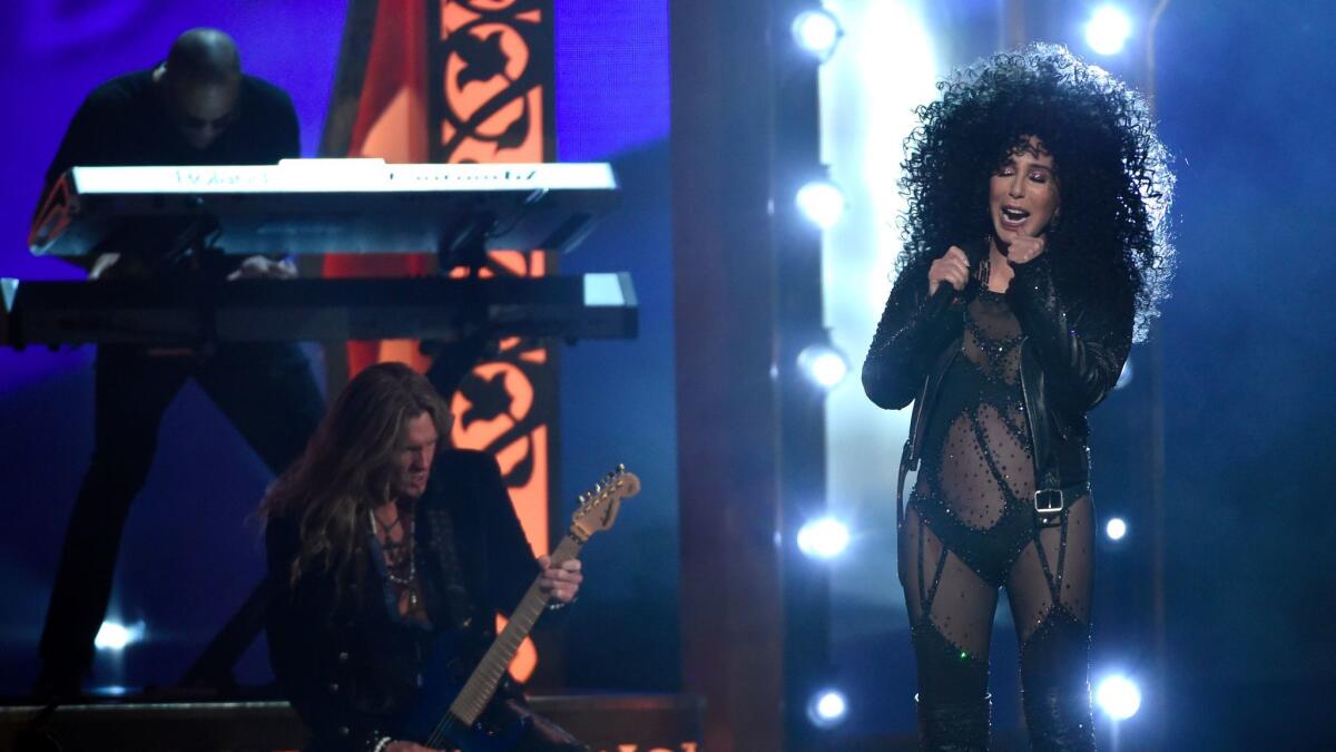 Cher performs in full "If I Could Turn Back Time" regalia. (Chris Pizzello / Invision/Associated Press)