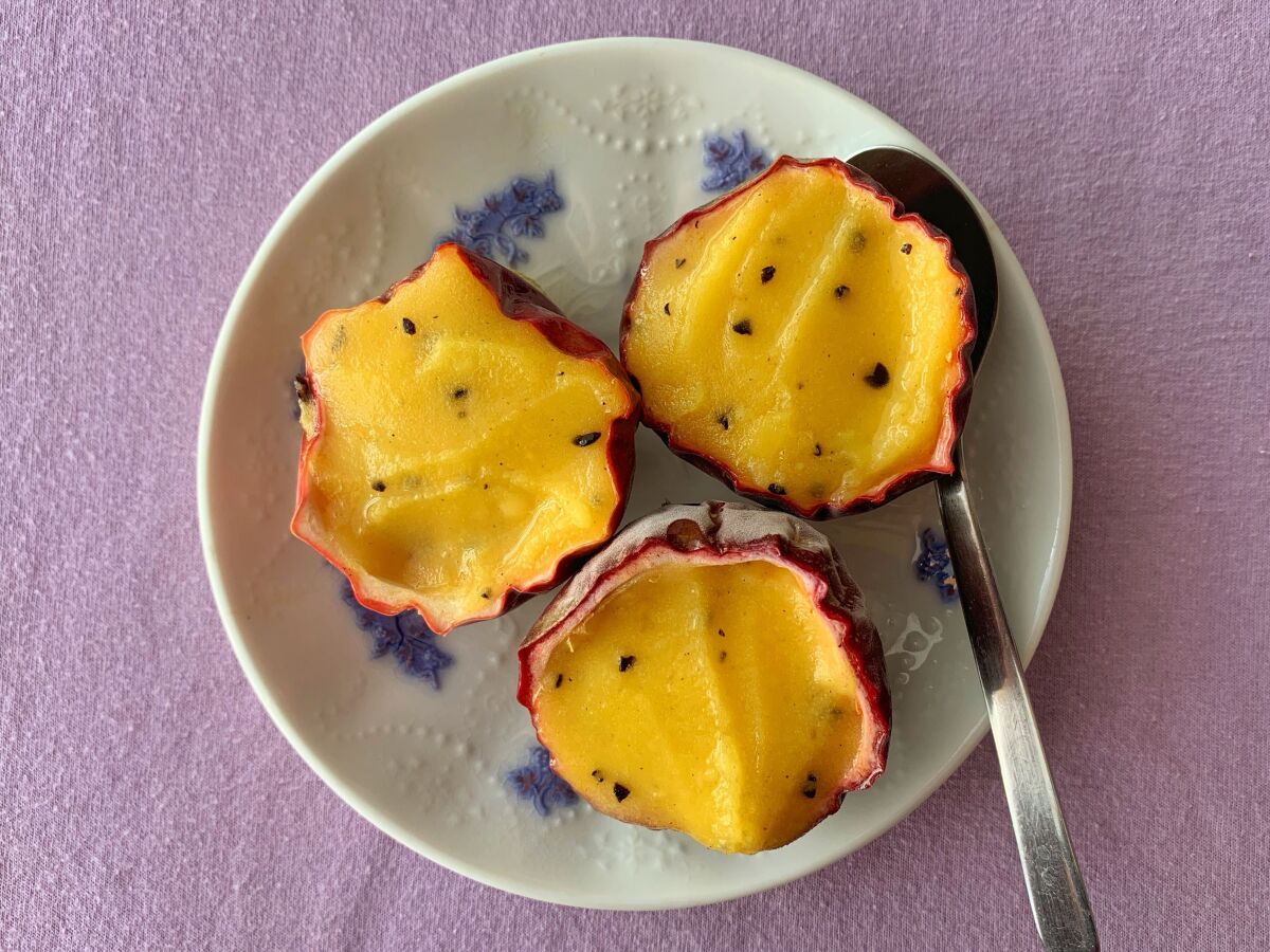 Passion fruit ice served in the fruit's shell.