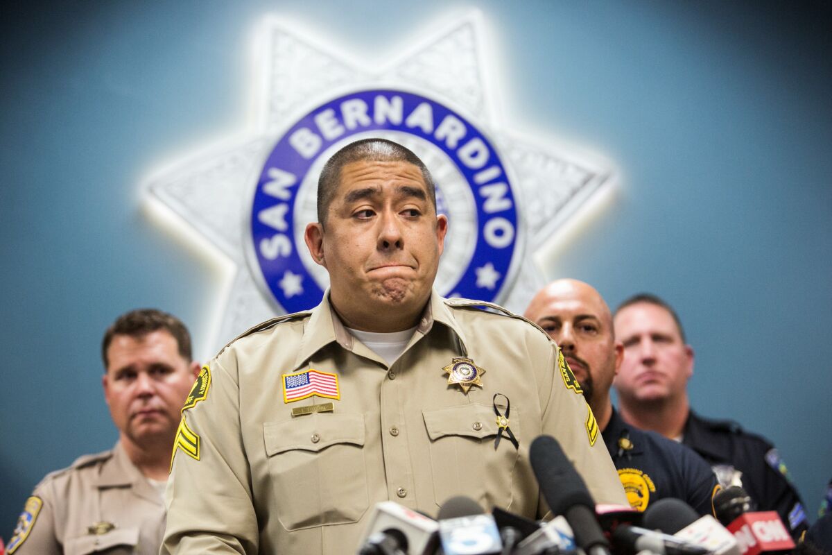 Det. Jorge Lozano of the San Bernardino County Sheriff's Department, who helped lead shooting survivors to safety last week and reassured them by saying, "I'll take a bullet before you do," describes the situation at a Dec. 8 news conference.