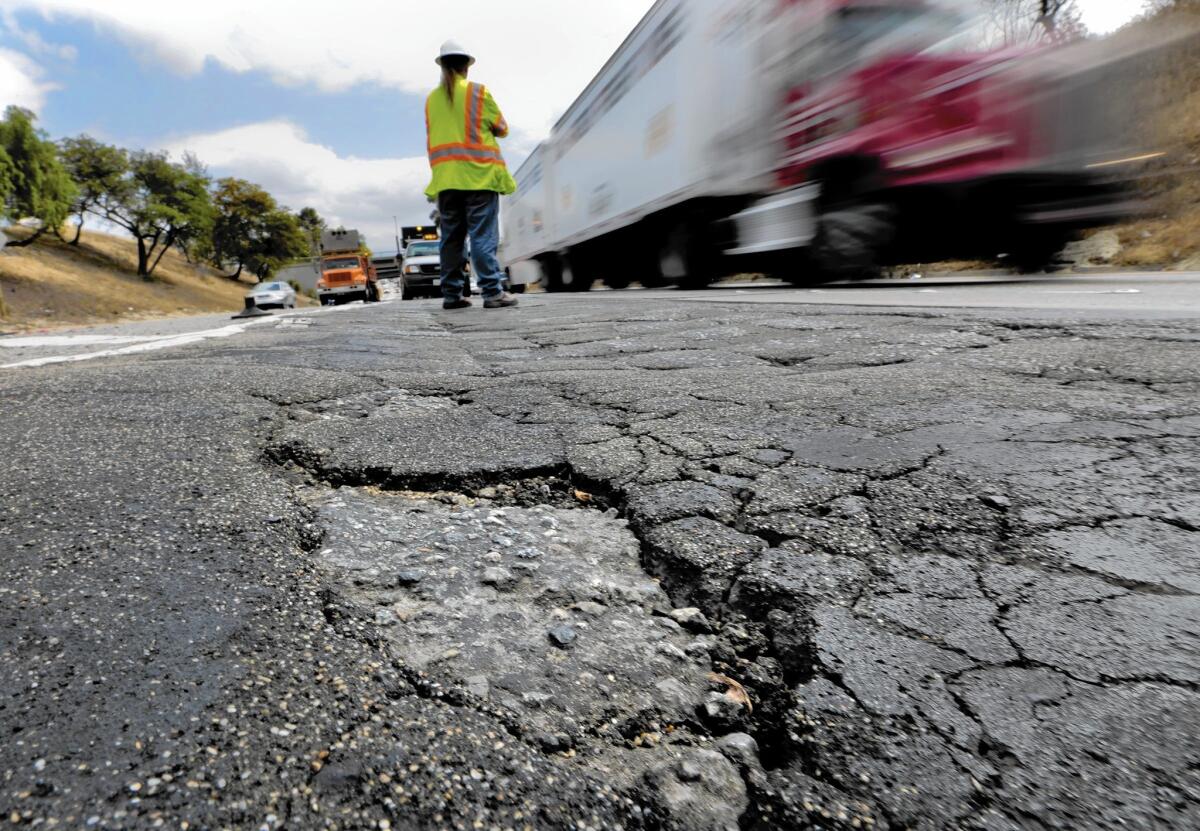 California Gov. Jerry Brown says the state gasoline tax is generating $2.3 billion annually for highway repairs, but $5.7 billion more is needed.
