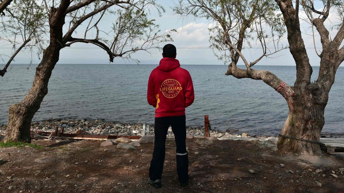 A member of the Proactiva Open Arms rescue team looks at the sea at their base near Skala Sykamiasn on the island of Lesbos on March 15.