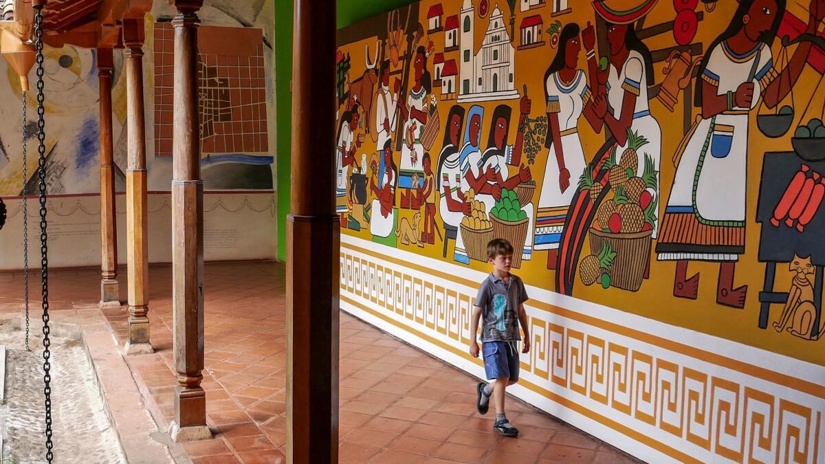 Liam searches for answers during a family treasure hunt in Granada's cultural museum housed in the San Francisco Convent. (Katie Quirk)