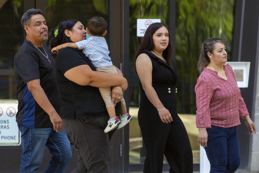 Relatives of victims of the El Paso Walmart mass shooting leave the federal court in El Paso, Texas, Wednesday, July 5, 2023. Patrick Crusius, who is accused of killing nearly two dozen people in a racist attack at an El Paso Walmart in August 2019, is set to receive multiple life sentences after pleading guilty to federal hate crimes and weapons charges in one of the deadliest mass shootings in U.S. history. (AP Photo/Andrés Leighton)