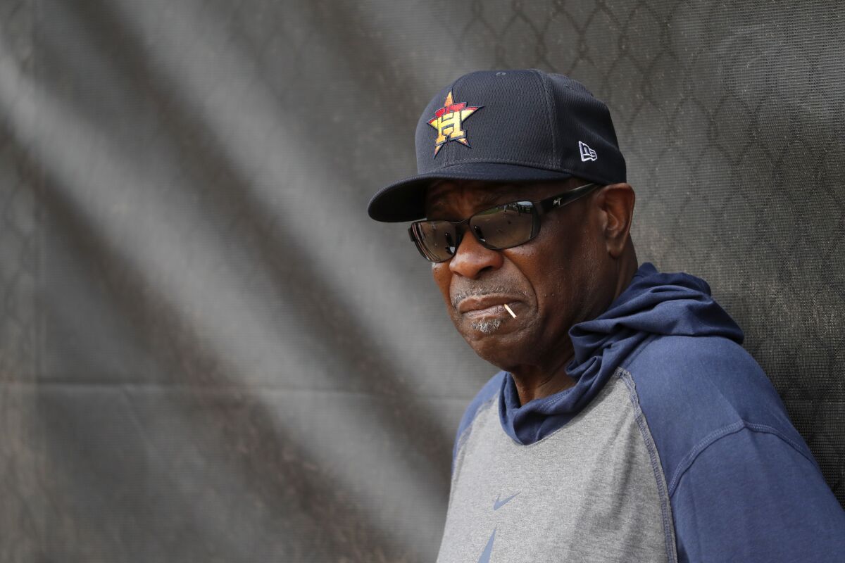 Houston Astros manager Dusty Baker watches practice.